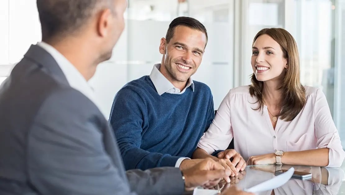 Man and woman meeting with a financial advisor 