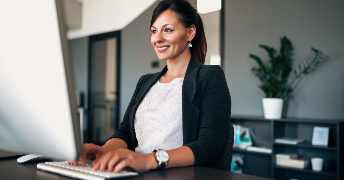 Smiling woman working at desk