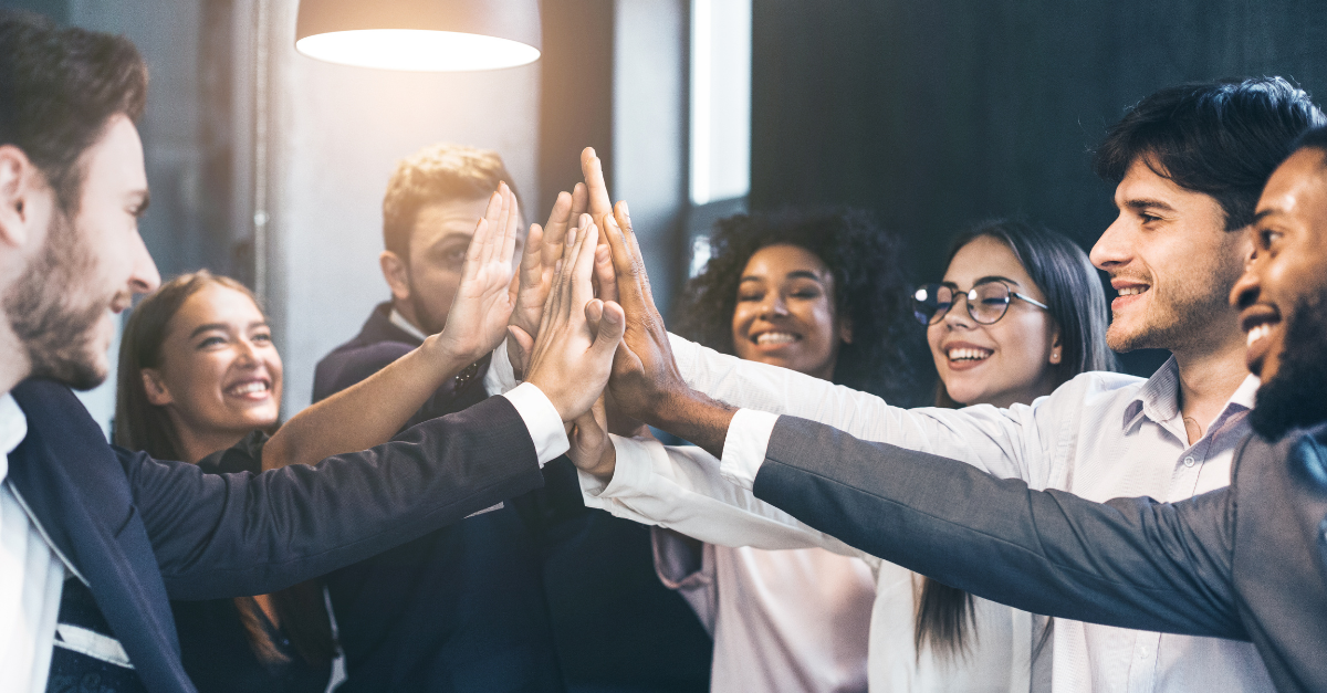 Office team celebrating with high five