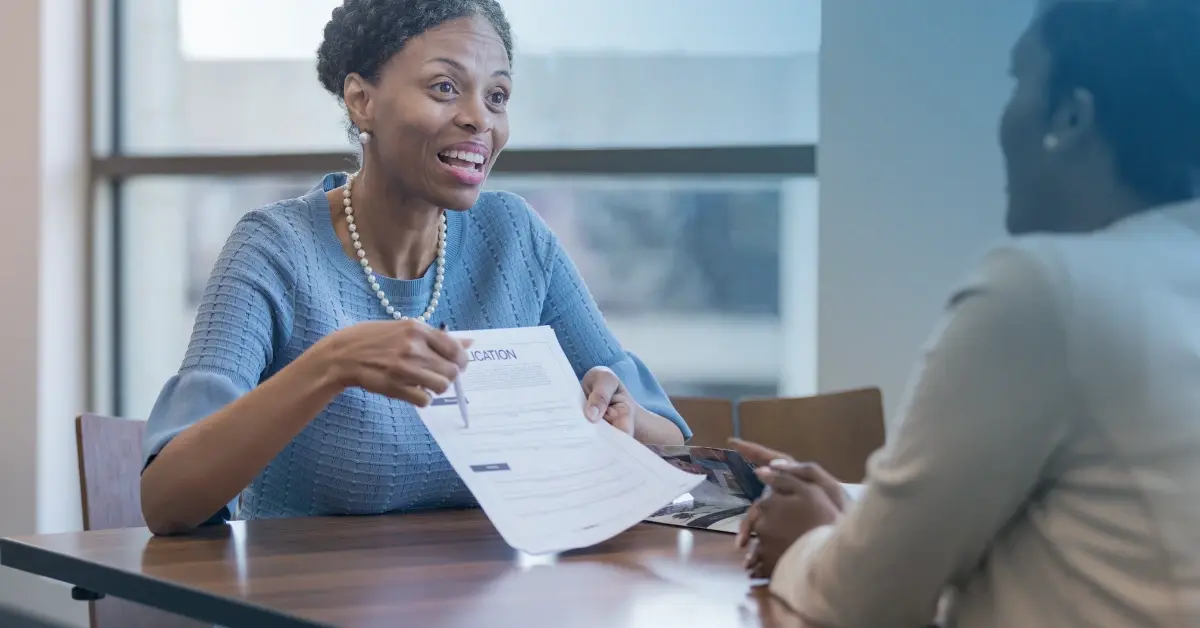 Banker woman helping customer with loan application 