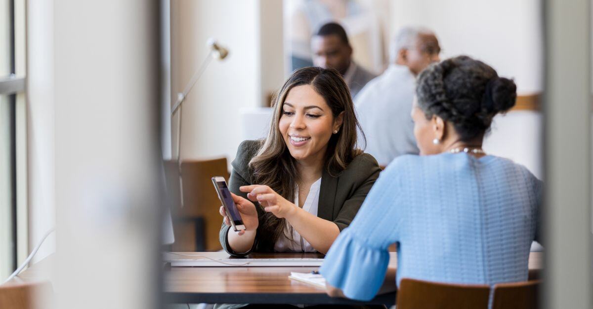 Banking professional helping customer at desk