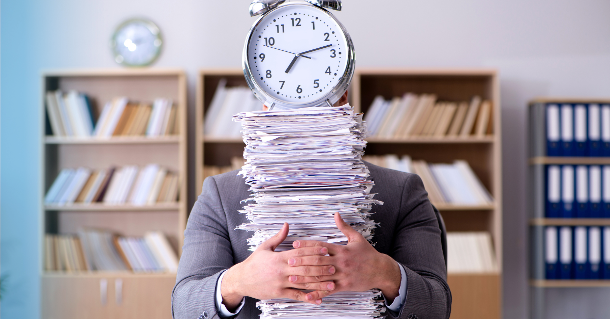 Person hiding behind stack of mail with clock on top 