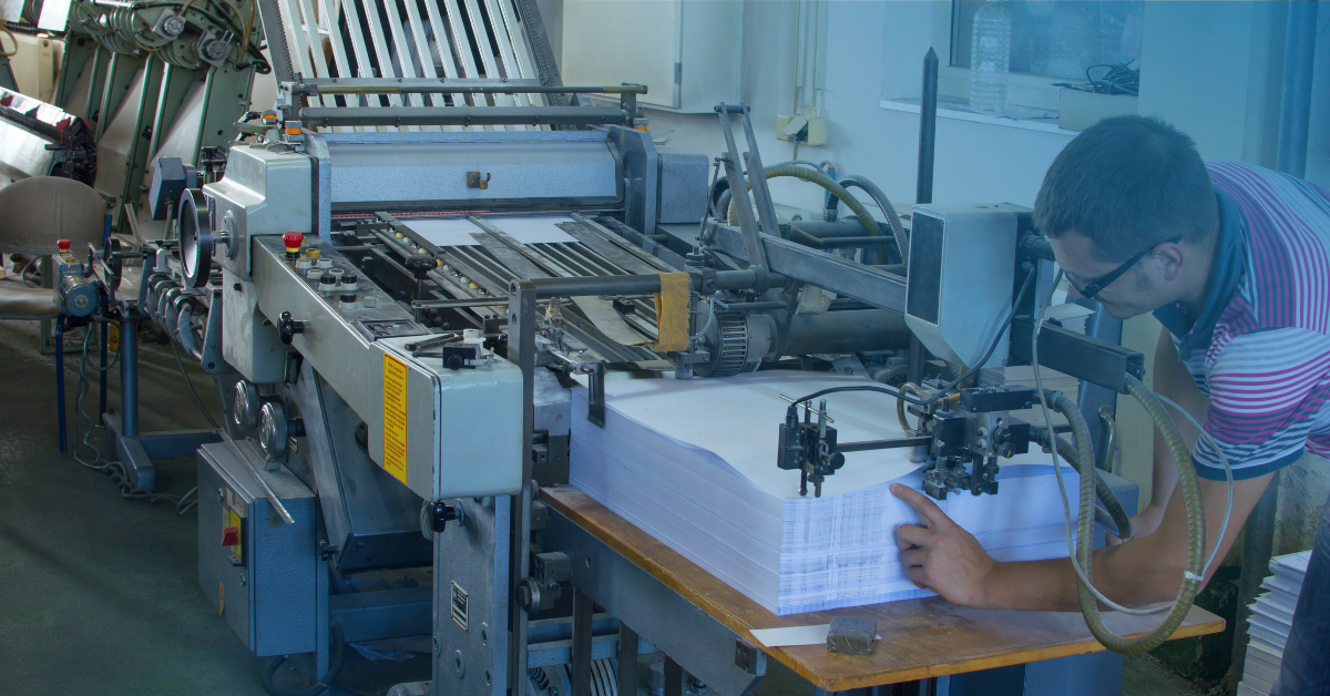 Person working on cut sheet printer