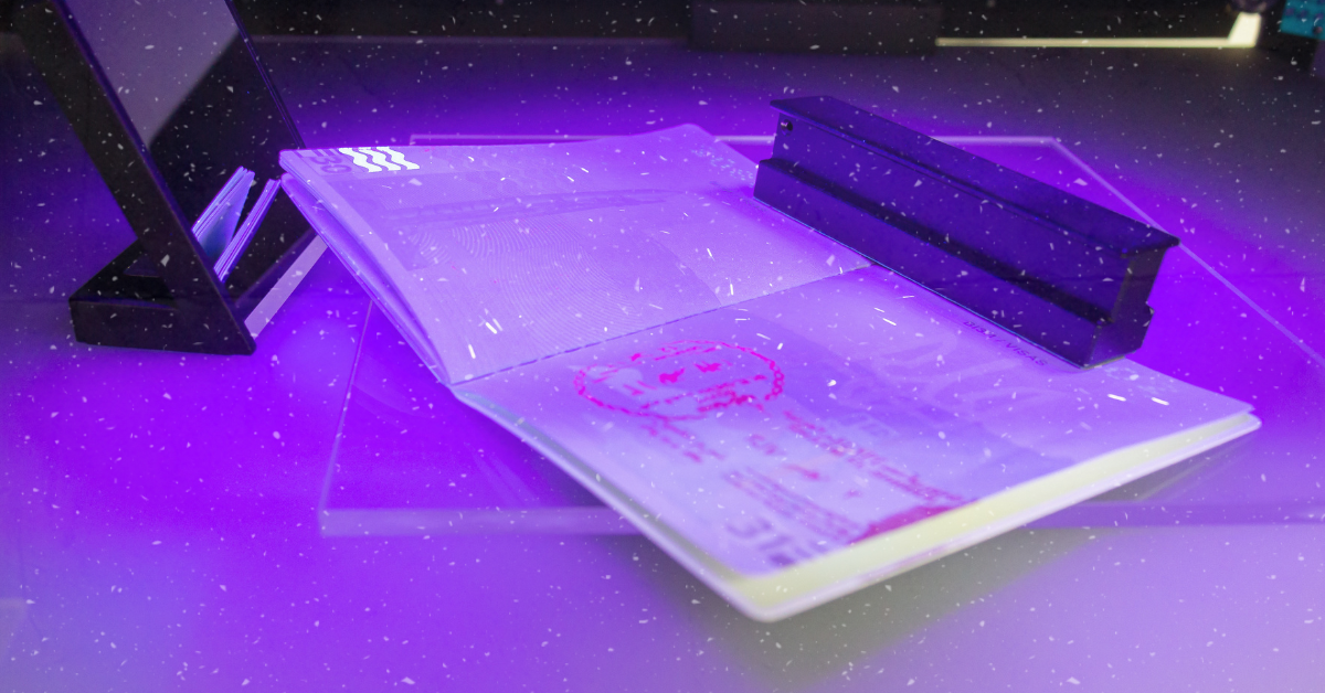 Passport with UV security ink fluorescing 