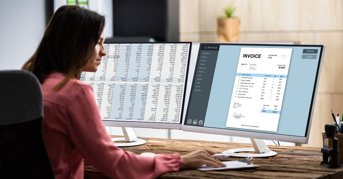 Accounts payable worker viewing invoice on computer