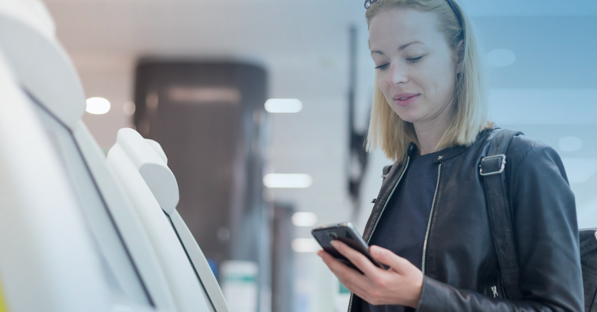 Woman on phone using ITM machine